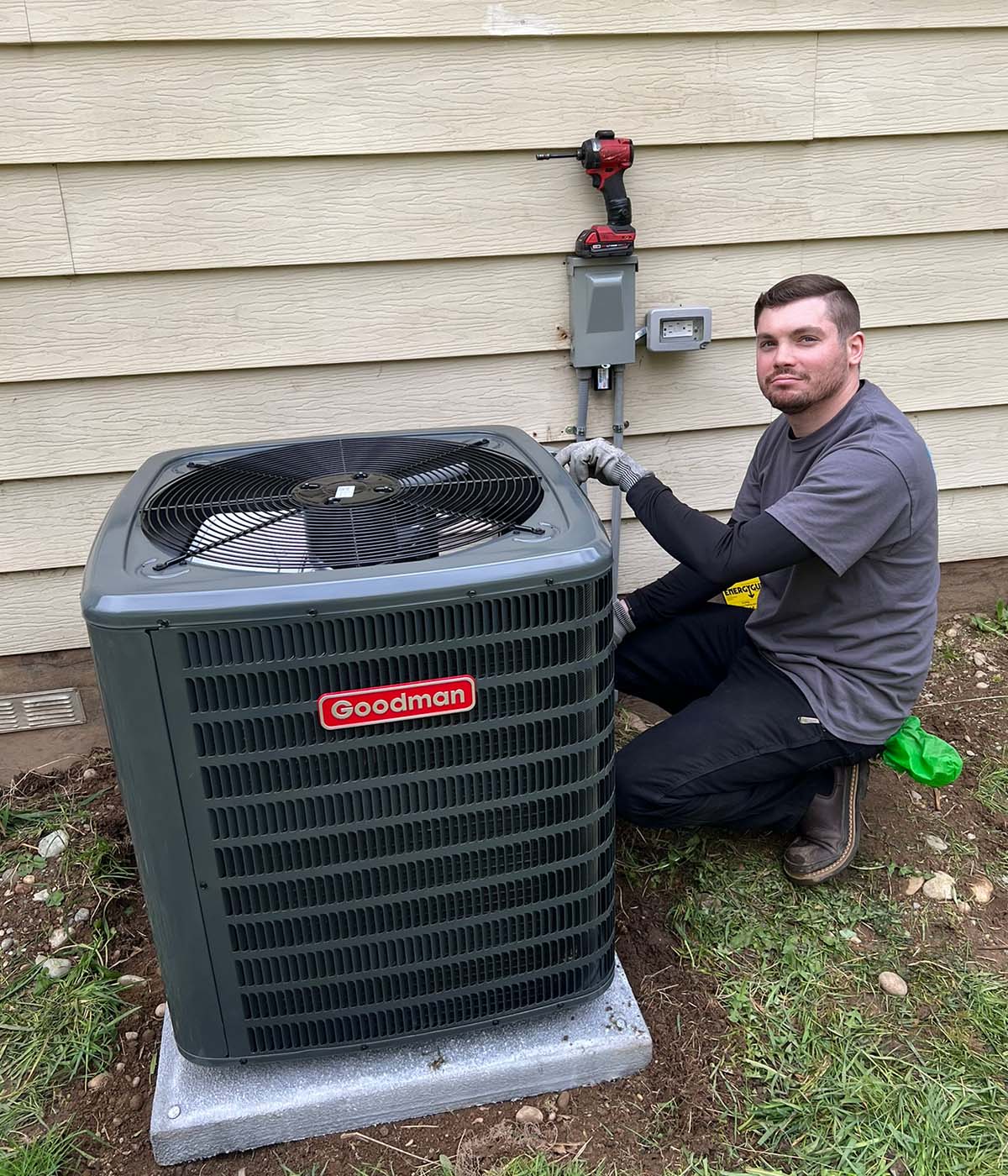 HVAC technician performing maintenance on an air conditioning system.